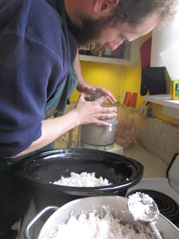 Sean is grating the lard and rendering it in the two pots.