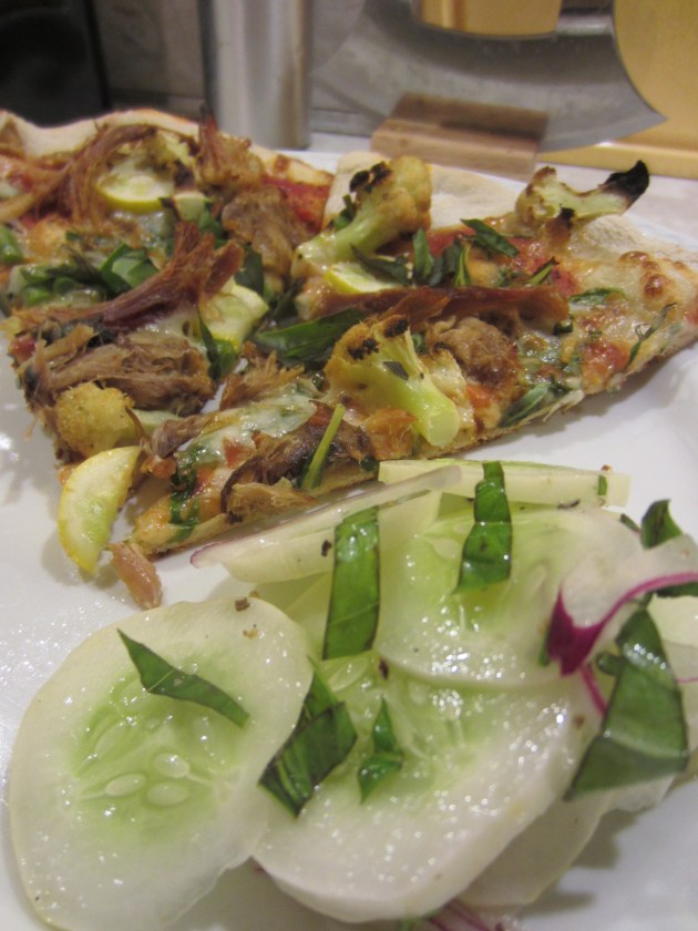 Delicious cucumber salad to go with our pizza. Our first two cucumbers of the season.