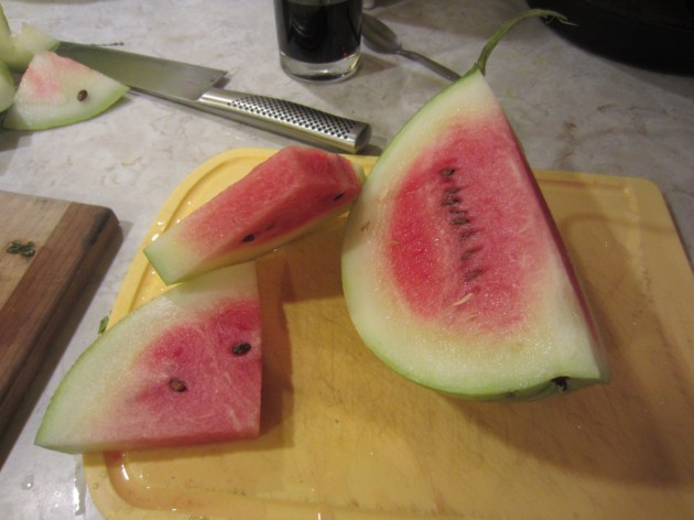 Our first (pink) watermelon. It's hard to know when they're ready, and melons left in the garden too long invariably get devoured by the hungry Chunky family.