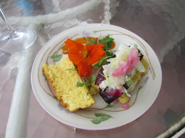 Pork belly sliders served on brioche with fennel slaw and microgreens and a splash of Asian barbeque sauce.